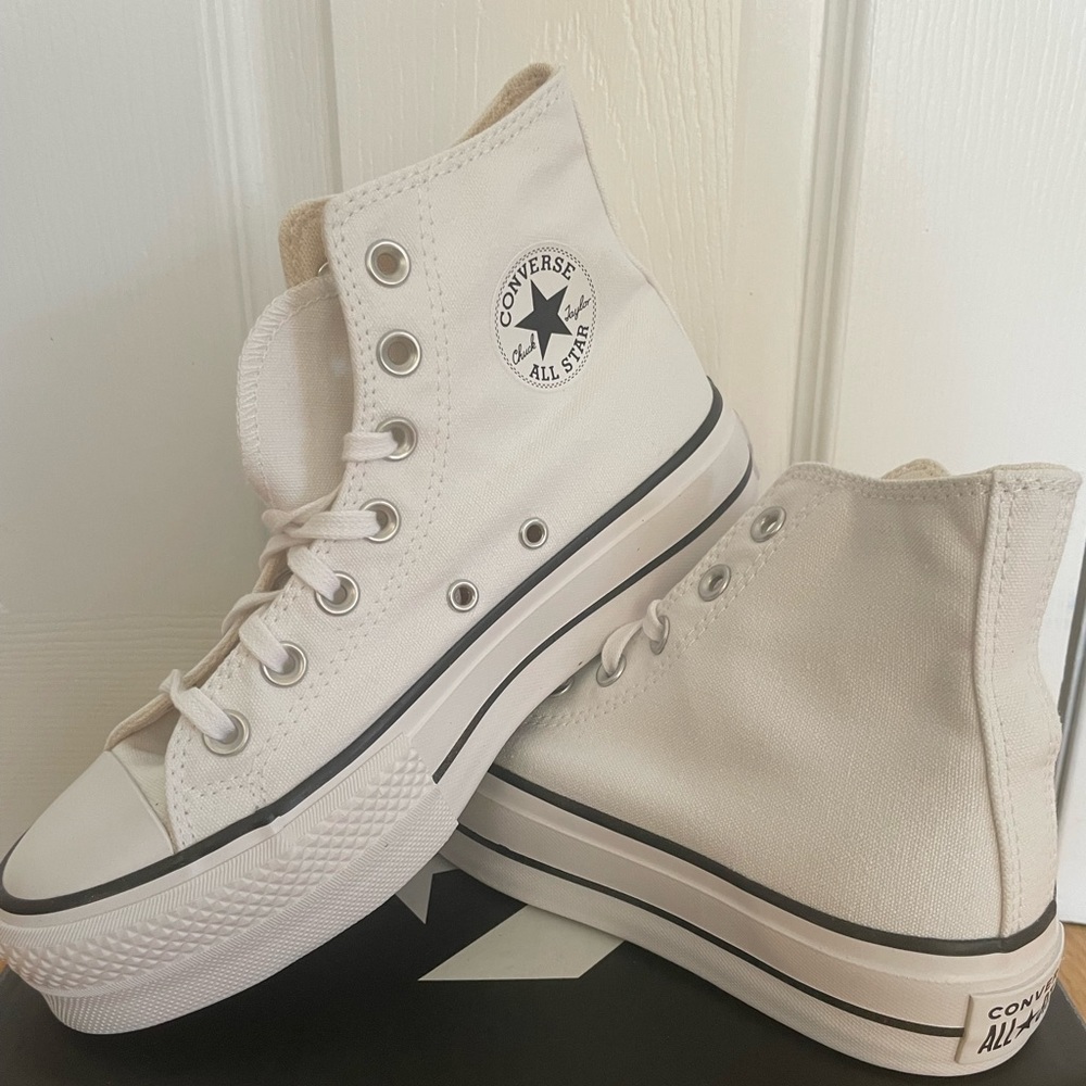 Never been worn. White platform converse. US size 6.